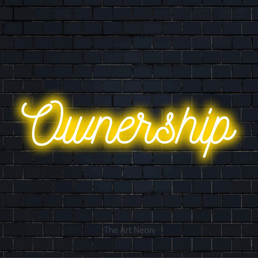 "Ownership" LED neon sign on a black brick wall