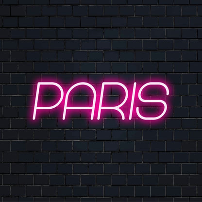Paris Neon Sign, soft neon glow against brick backdrop