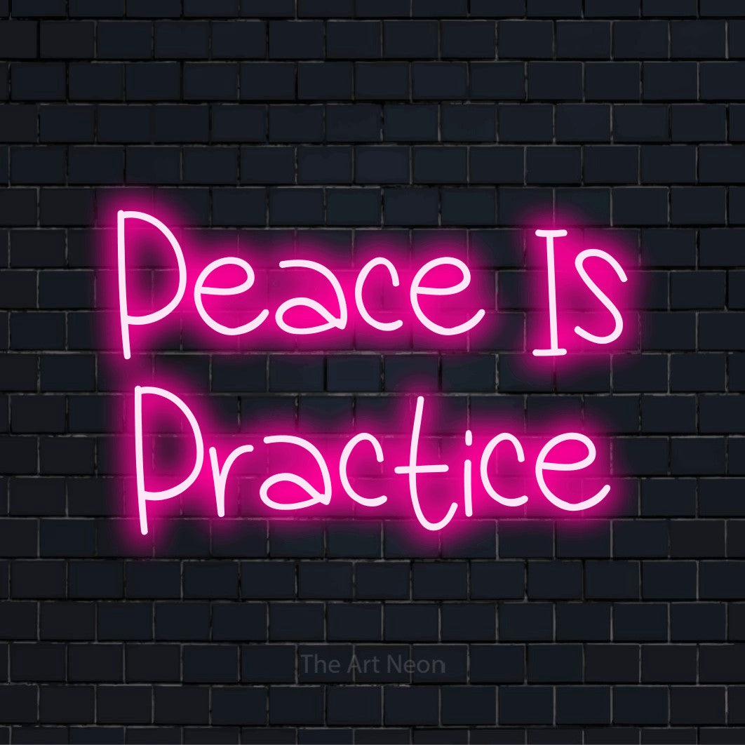 "Peace Is Practice" script-style LED neon sign on a black brick wall