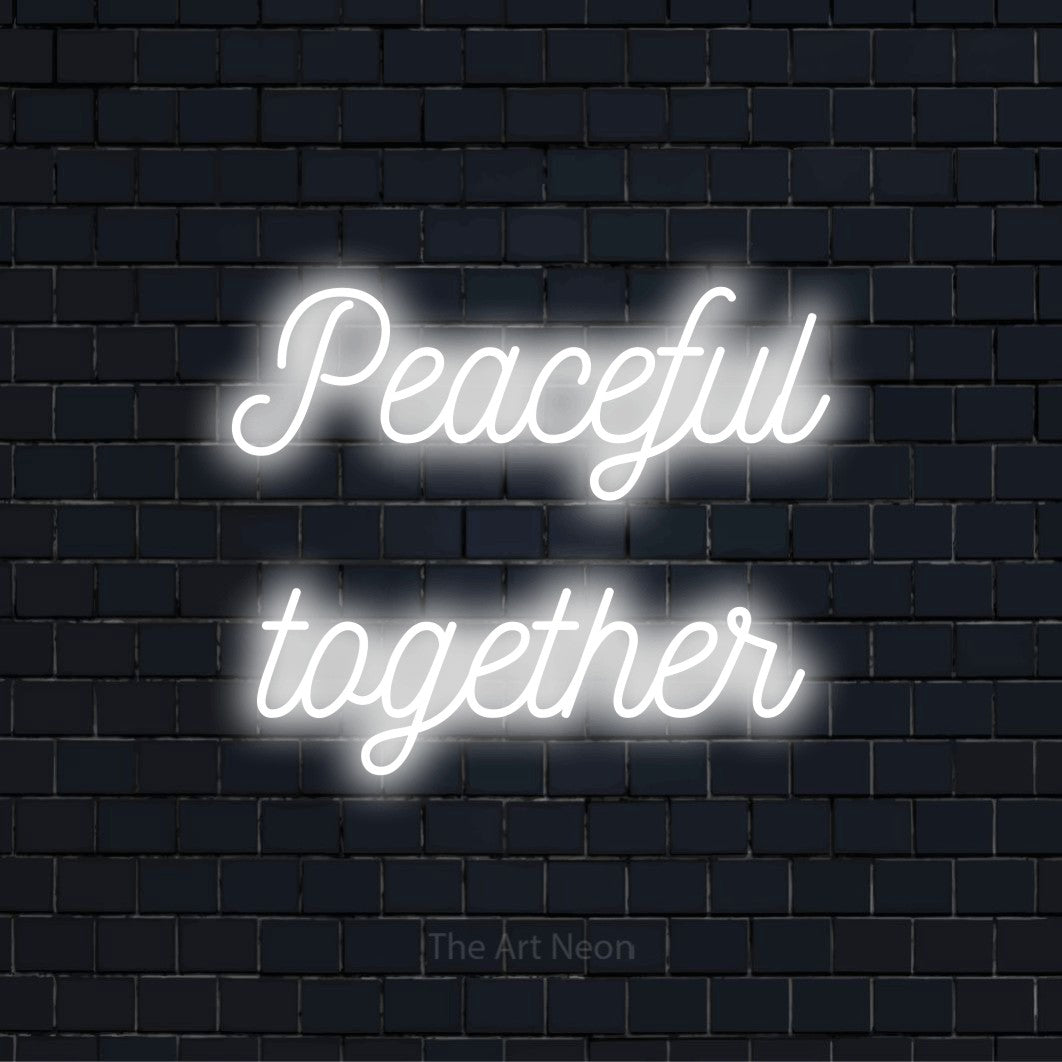 "Peaceful Together" LED neon sign on a black brick wall