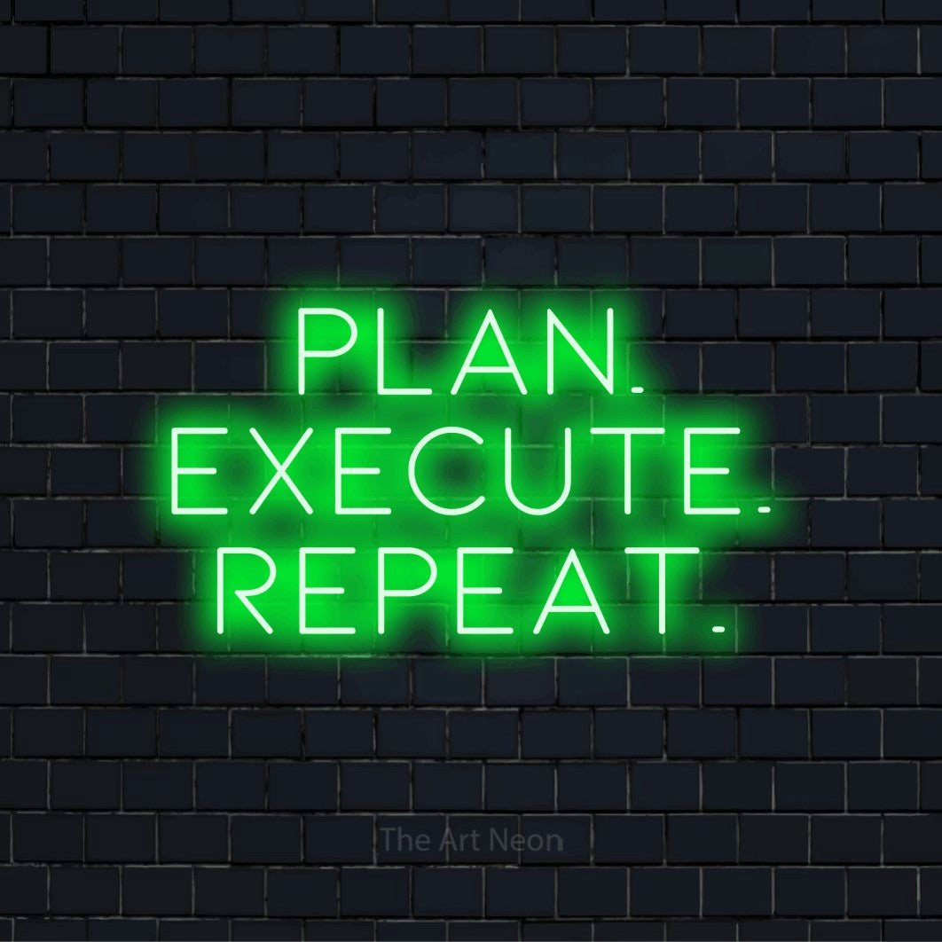 "Plan. Execute. Repeat." LED neon sign on a black brick wall