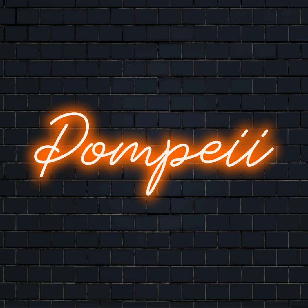 Pompeii LED Neon Sign, neon text light on dark brick background