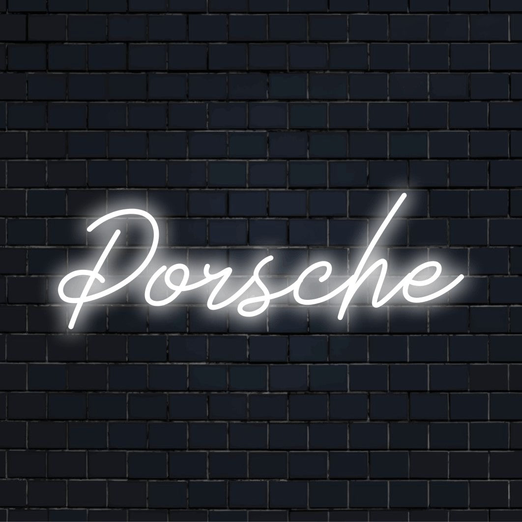 Porsche Neon Light with glowing neon text against brick backdrop