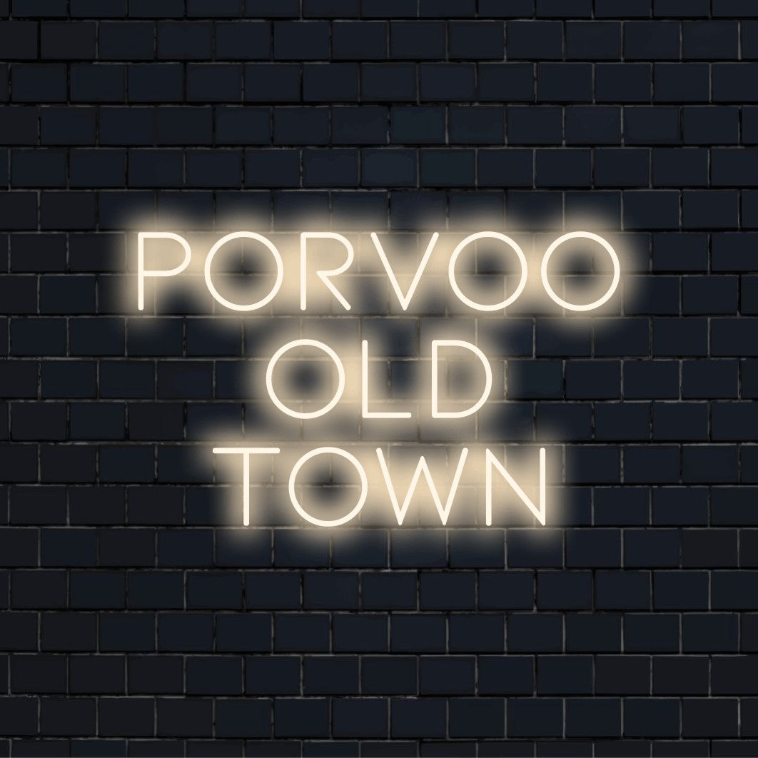 Porvoo Old Town Neon Sign, bright LED glow on dark brick wall