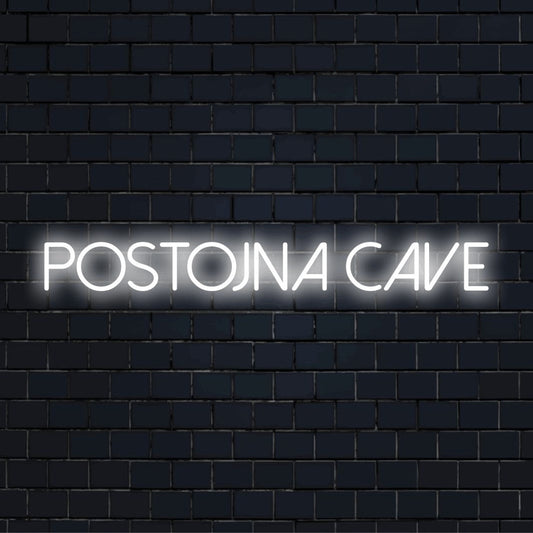 Postojna Cave Neon Sign, bright neon glow on dark brick wall
