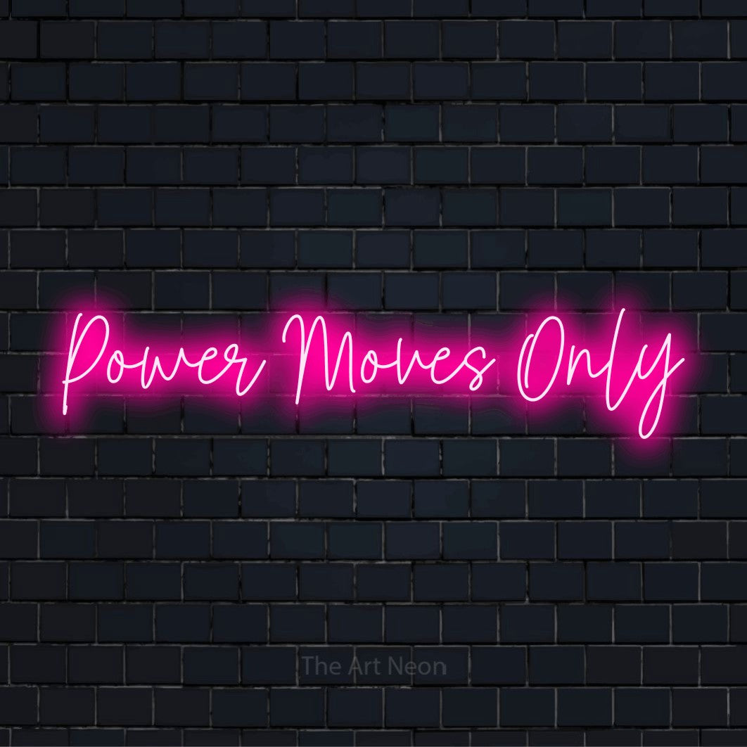 "Power Moves Only" script-style LED neon sign on a black brick wall