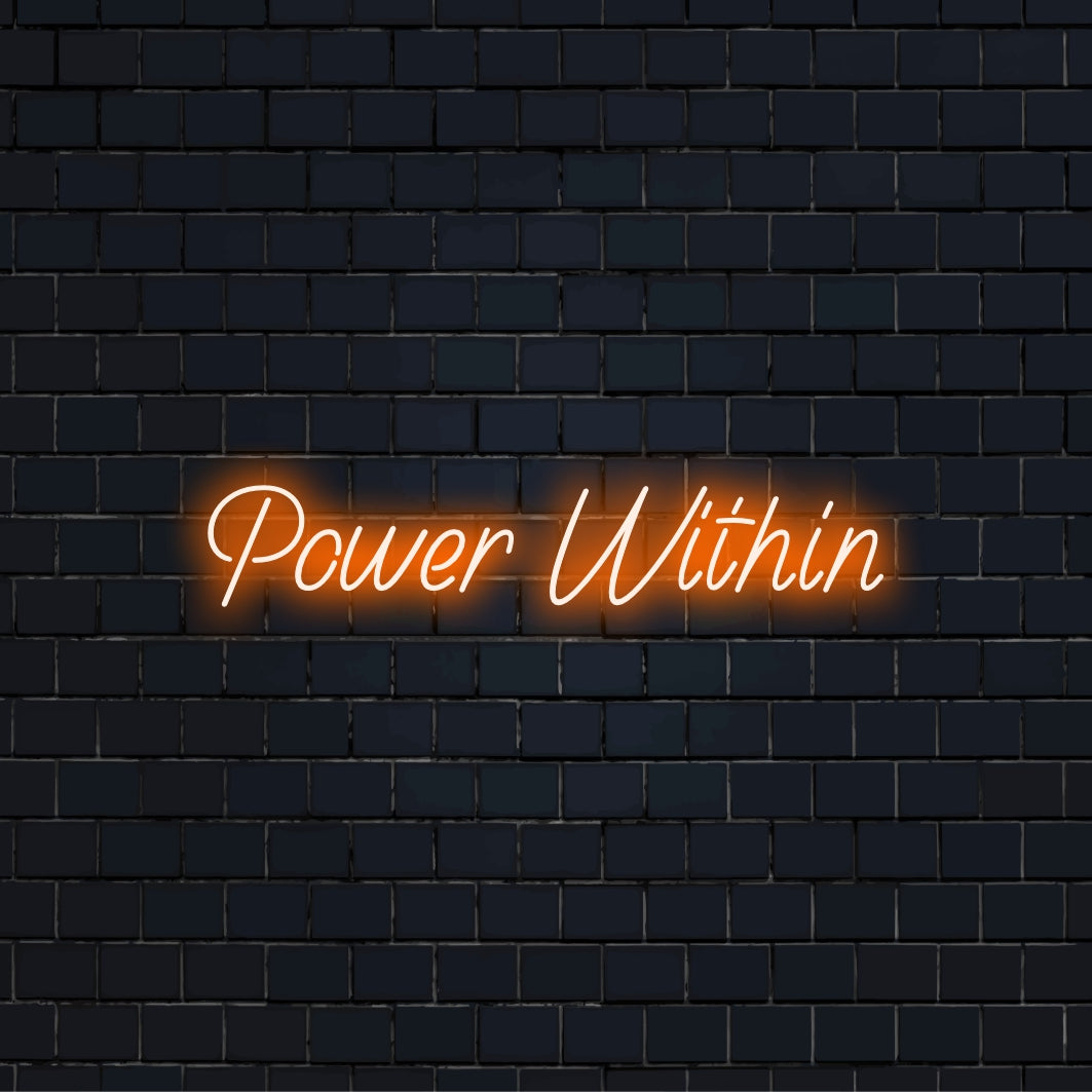 Power Within Neon Sign, bright neon lettering against black brick wall