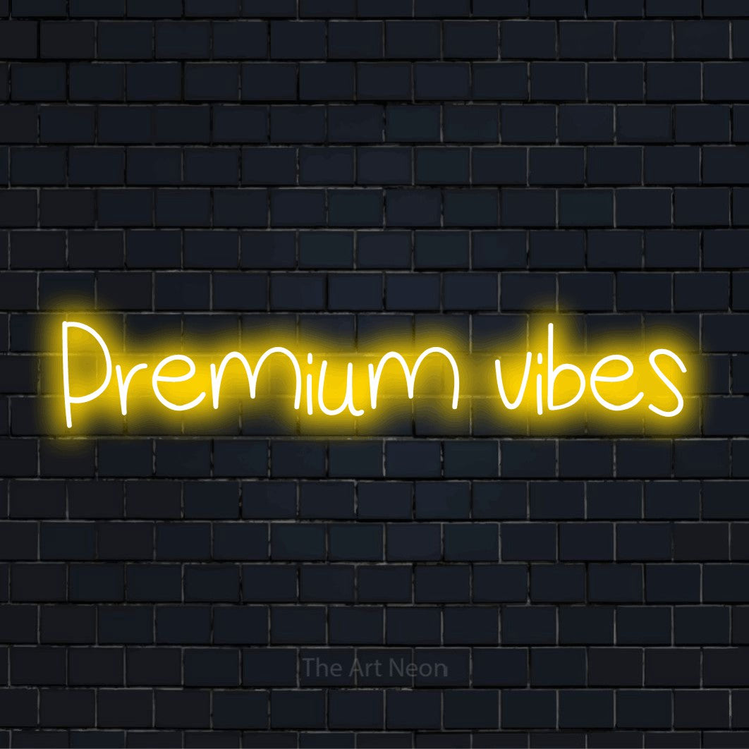 "Premium Vibes" script-style LED neon sign on a black brick wall