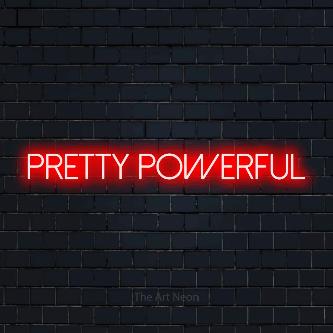 "Pretty Powerful" script-style LED neon sign on a black brick wall