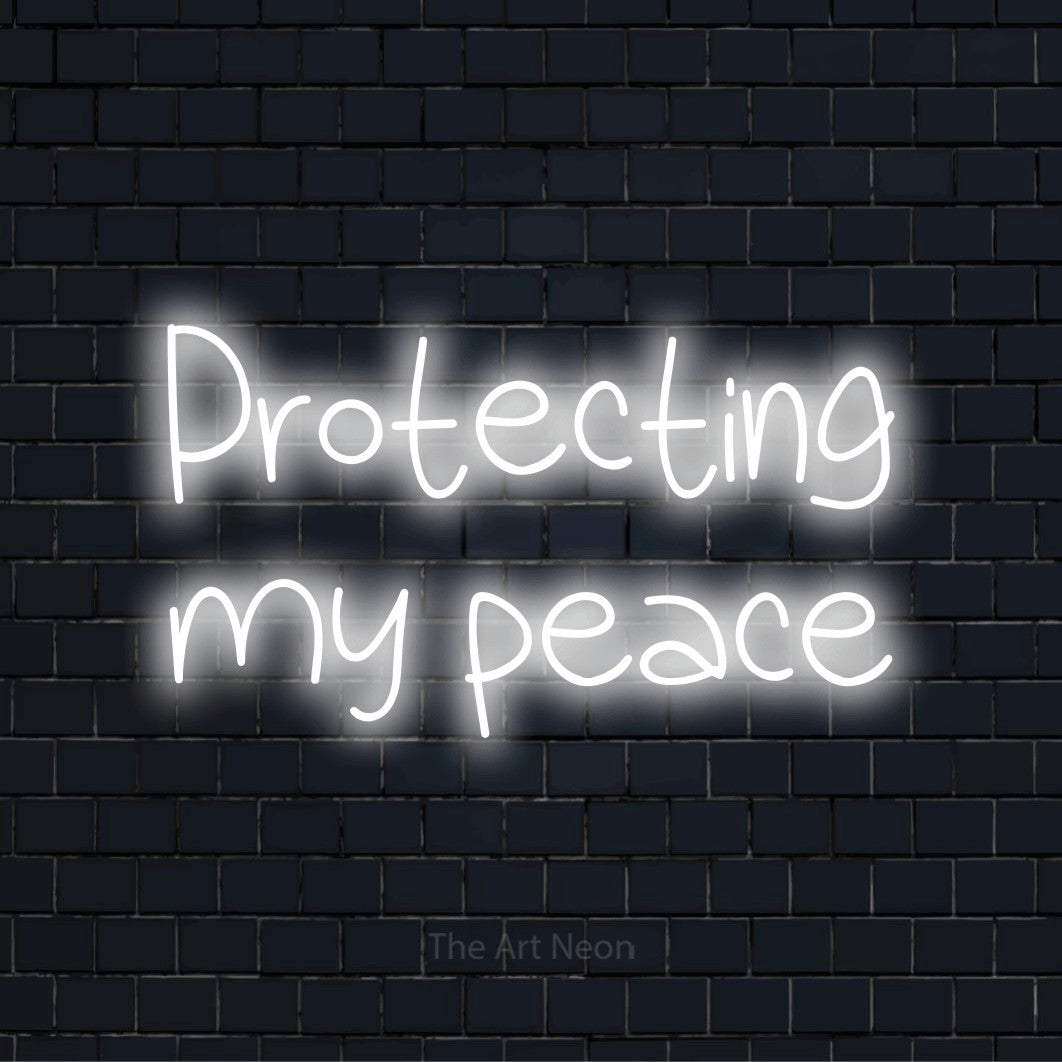 "Protecting My Peace" glowing LED neon sign on a black brick wall