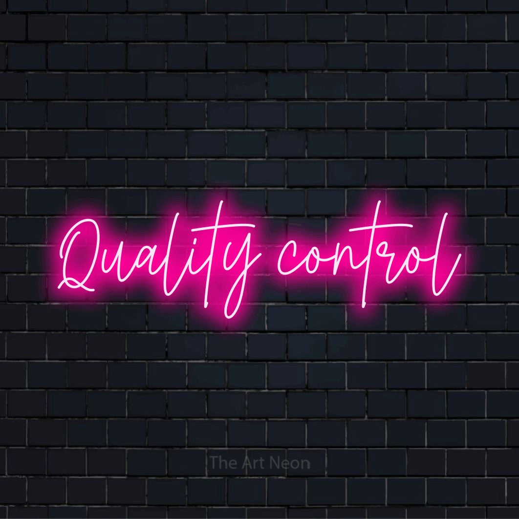 "Quality Control" neon text design on a black brick wall