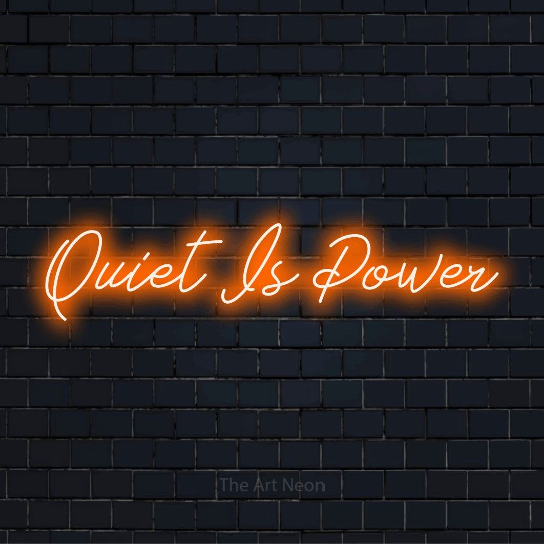 "Quiet Is Power" text design with neon effect on a black brick wall