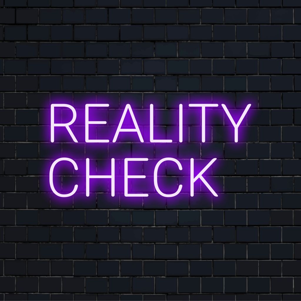 Reality Check LED Neon Sign, bright neon lettering on dark brick background