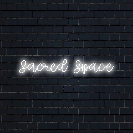Sacred Space Neon Sign, soft neon glow against brick backdrop