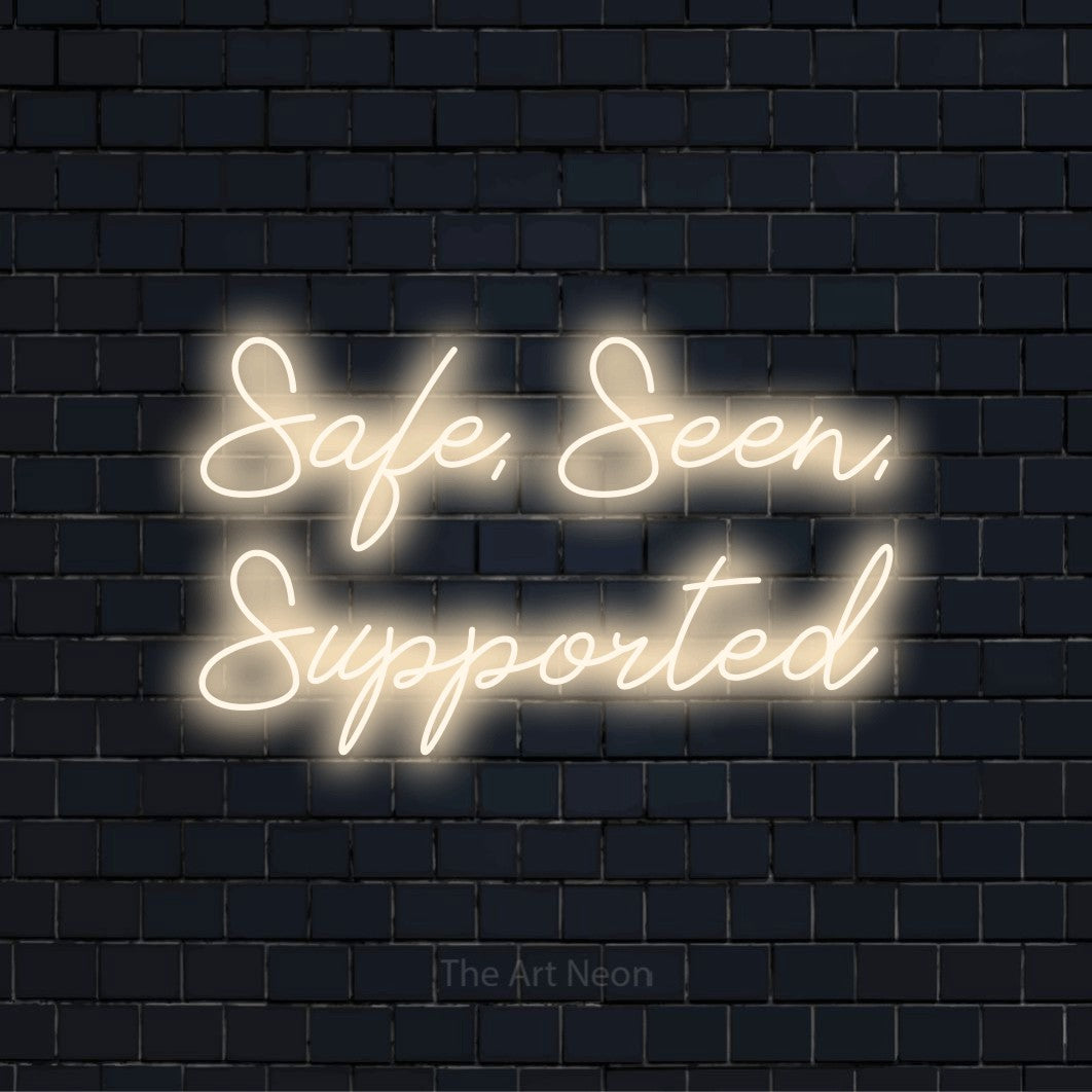 "Safe, Seen, Supported" text design with neon effect on a black brick wall