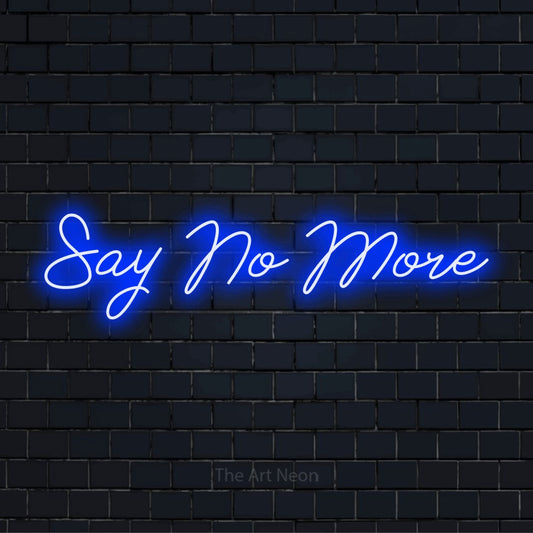 "Say No More" script-style LED neon sign on a black brick wall