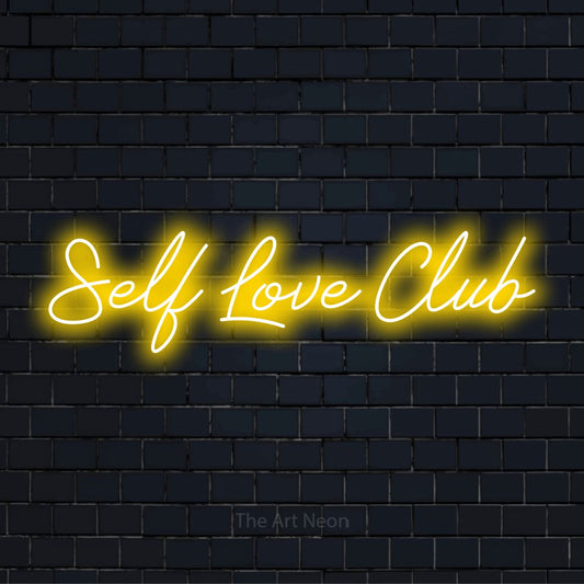 "Self Love Club" LED neon sign on a black brick wall