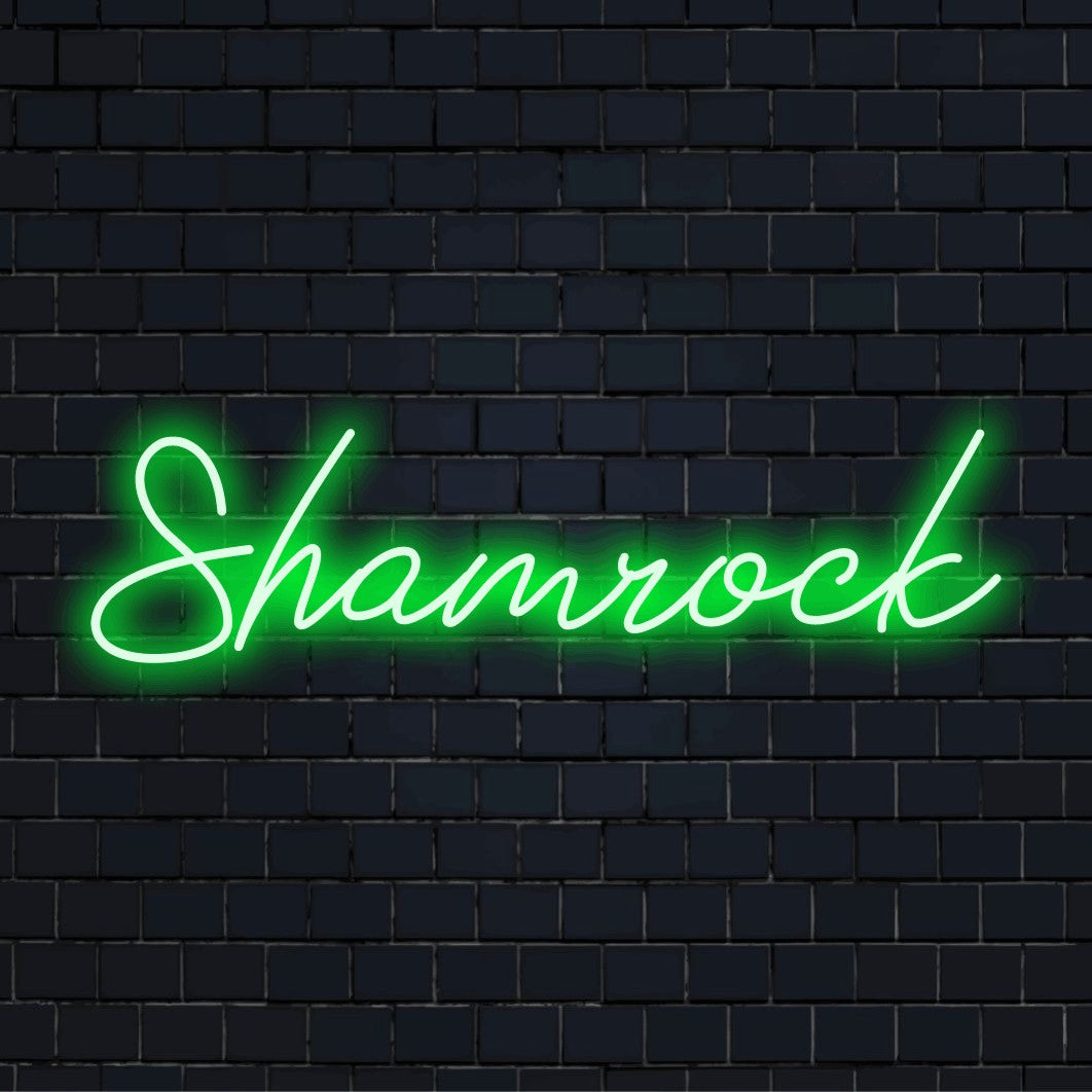 Shamrock LED Neon Sign, bright neon lettering on black brick background
