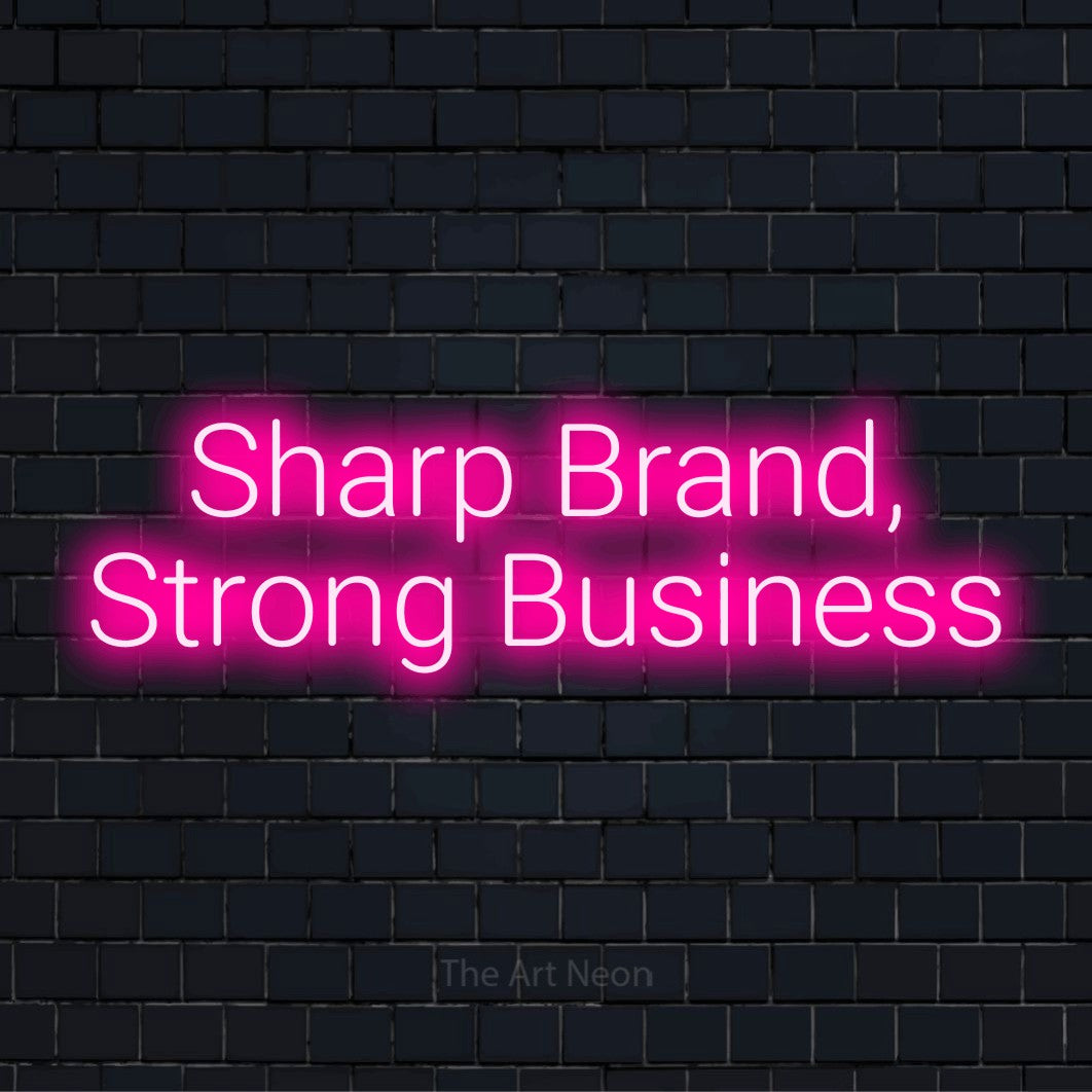 "Sharp Brand, Strong Business" LED neon sign on a black brick wall