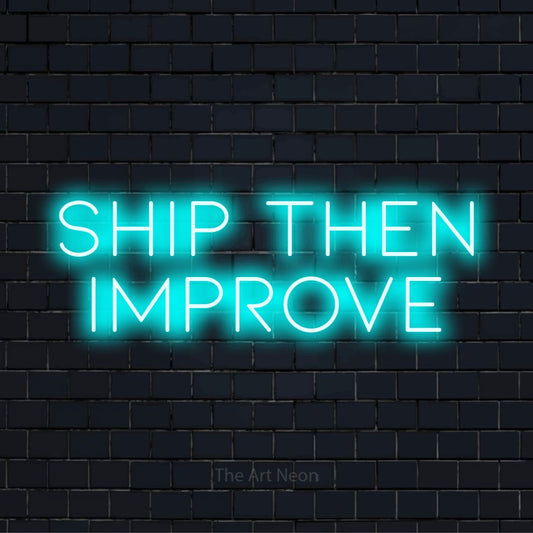 "Ship Then Improve" neon text design on a black brick wall
