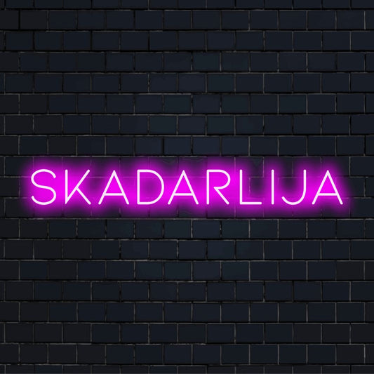 Skadarlija Neon Light with bright neon lettering on dark brick wall