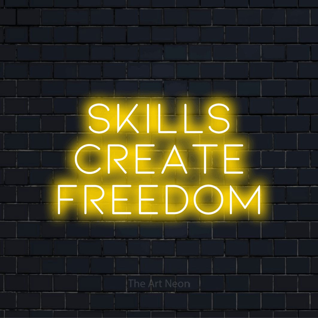 "Skills Create Freedom" text design with neon effect on a black brick wall