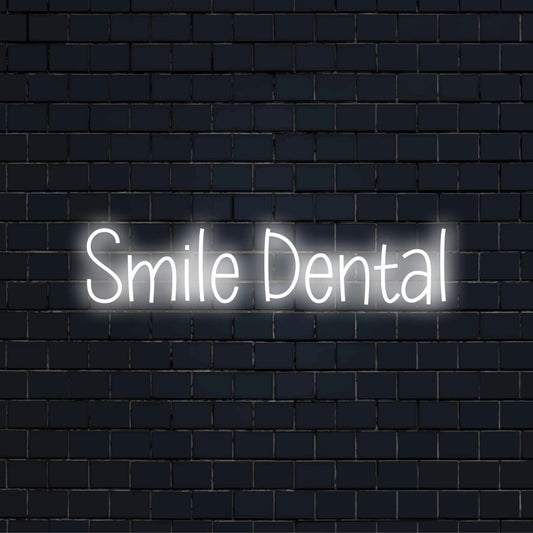 Smile Dental LED Neon Sign, bright neon lettering against brick backdrop