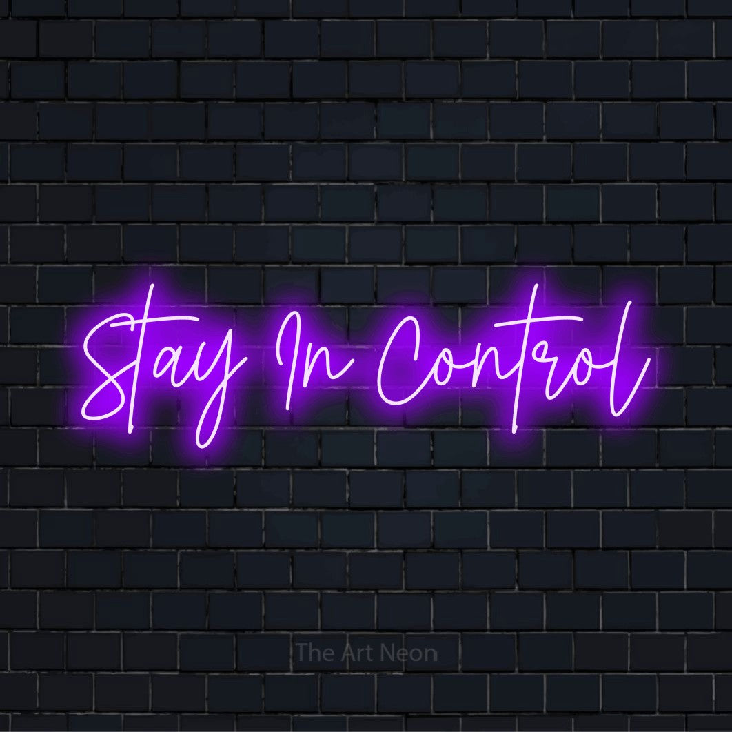 "Stay In Control" glowing LED neon sign on a black brick wall