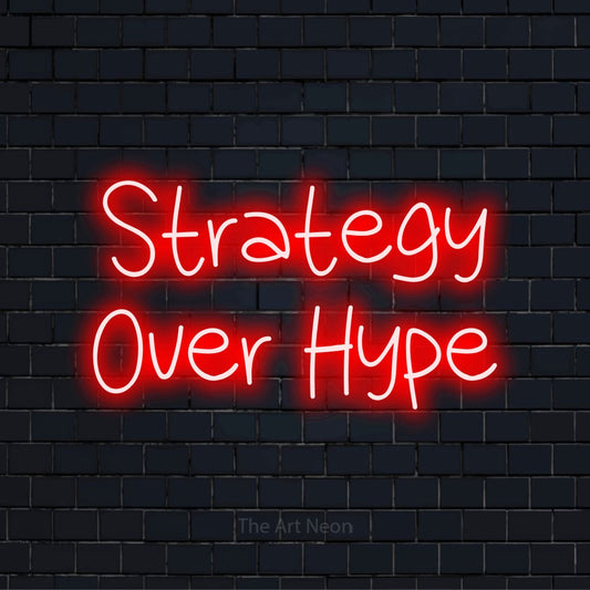 "Strategy Over Hype" text design with neon effect on a black brick wall