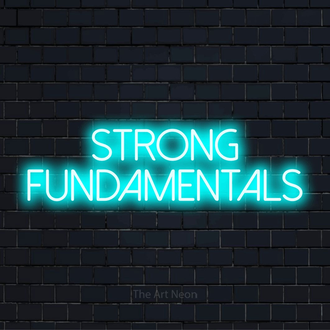 "Strong Fundamentals" glowing LED neon sign on a black brick wall