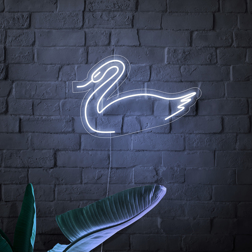 O letreiro de neon em forma de cisne é um complemento elegante para decoração temática, emanando uma sensação de graça e emitindo uma luz cativante.