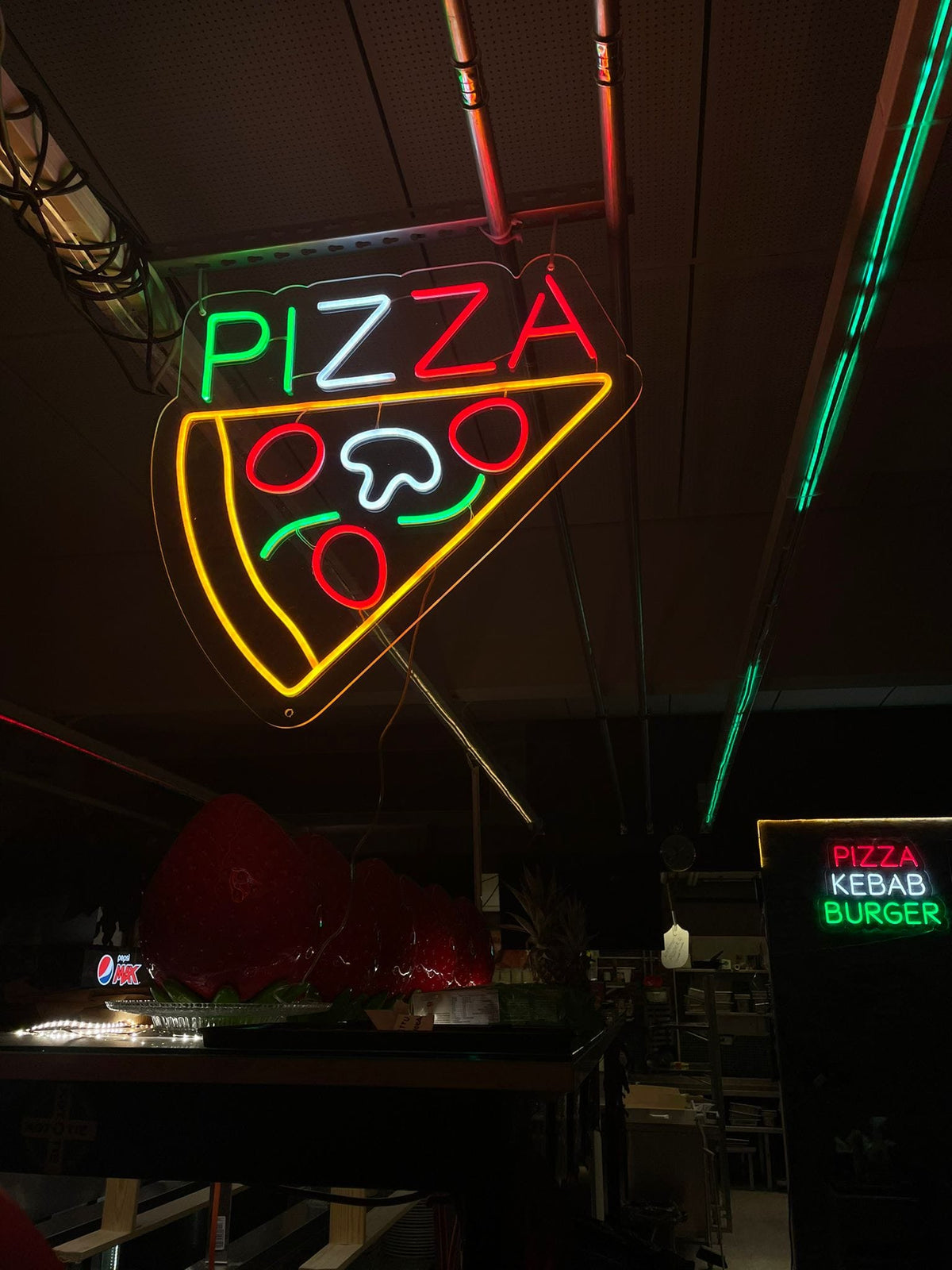 Red outdoor Drive-Thru OPEN LED neon sign at Kototie restaurant in snowy Seinäjoki