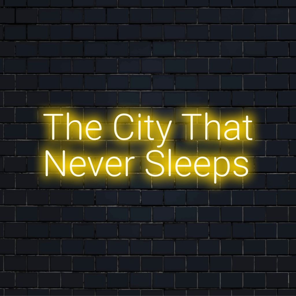 The City That Never Sleeps LED Neon Sign, bright LED glow on black brick background