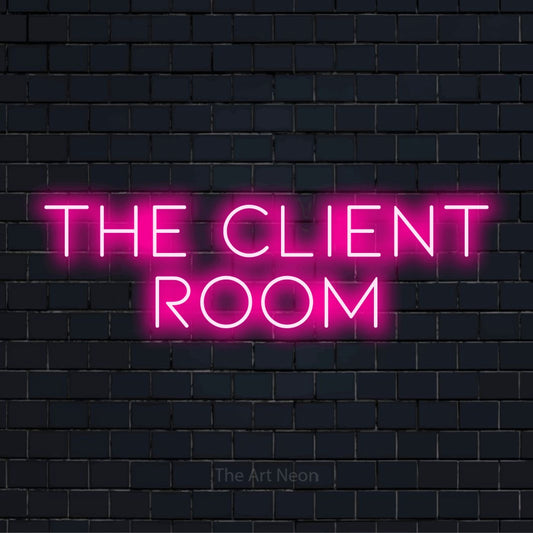 "The Client Room" script-style LED neon sign on a black brick wall