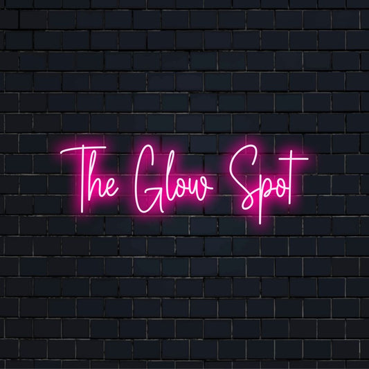 The Glow Spot Neon Light with soft neon glow against brick backdrop
