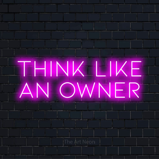 "Think Like An Owner" glowing LED neon sign on a black brick wall