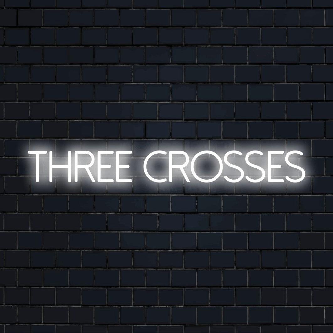 Three Crosses Neon Sign, glowing neon text on dark brick background