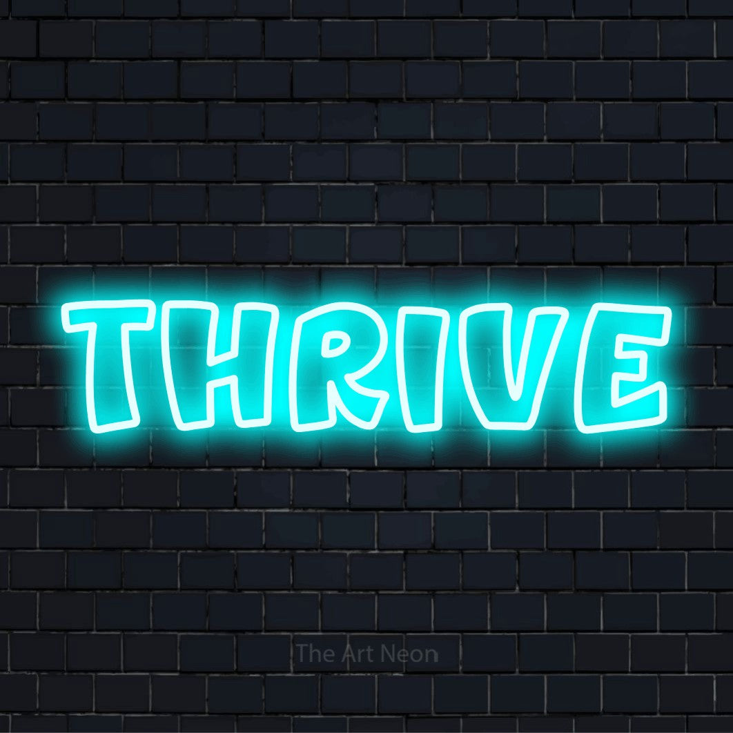 "Thrive" neon text design on a black brick wall