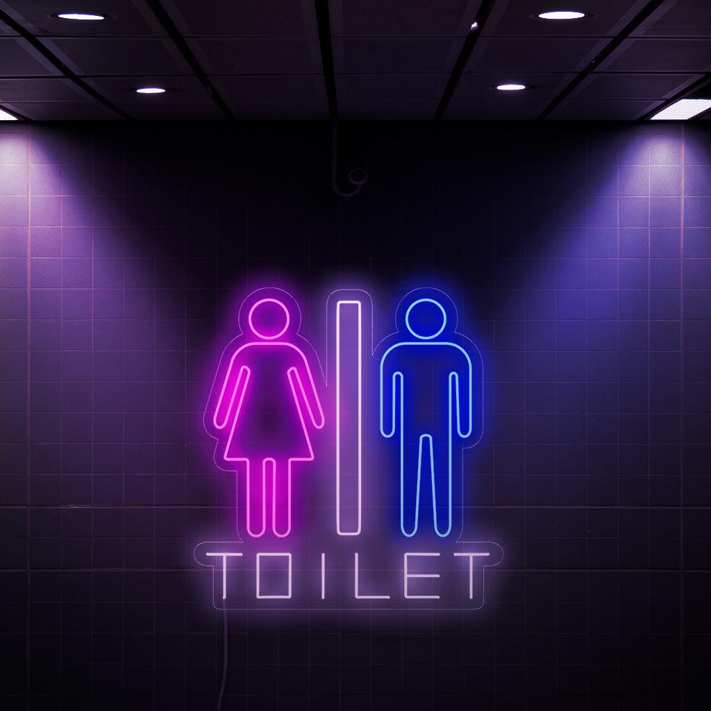 Um letreiro de neon cativante com os símbolos de uma mulher e um homem, além da palavra "Toilet" (Vaso sanitário). Este letreiro exclusivo adiciona um toque de estilo e funcionalidade aos banheiros, facilitando a localização para ambos os sexos.