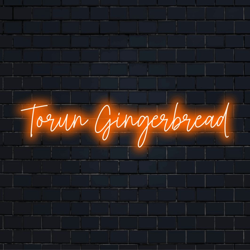 Torun Gingerbread Neon Sign, glowing neon text on dark brick background