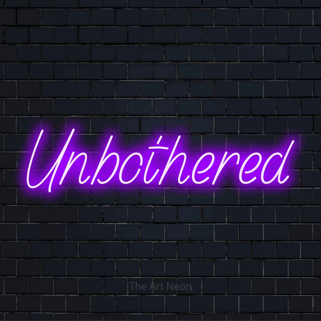 "Unbothered" LED neon sign on a black brick wall