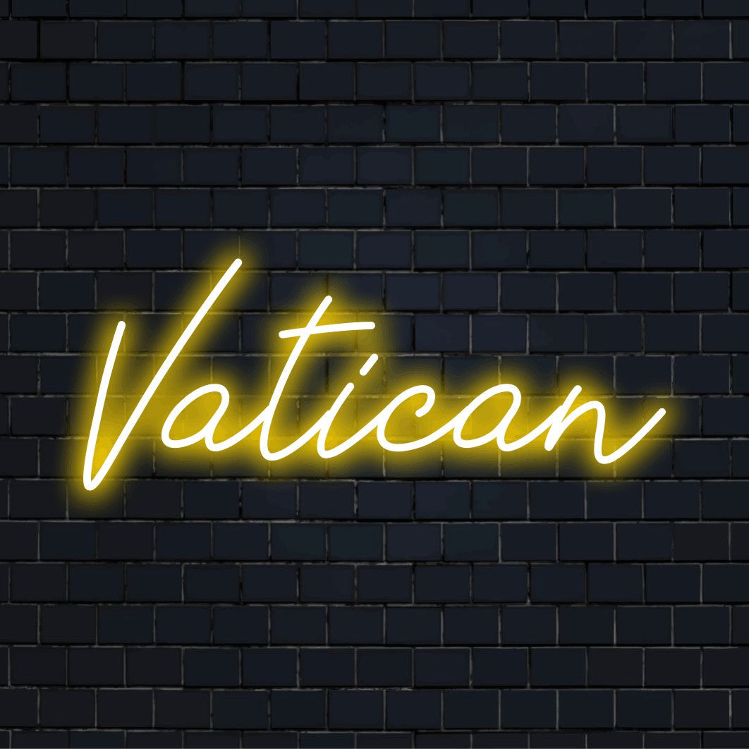 Vatican LED Neon Sign, glowing lettering against black brick wall