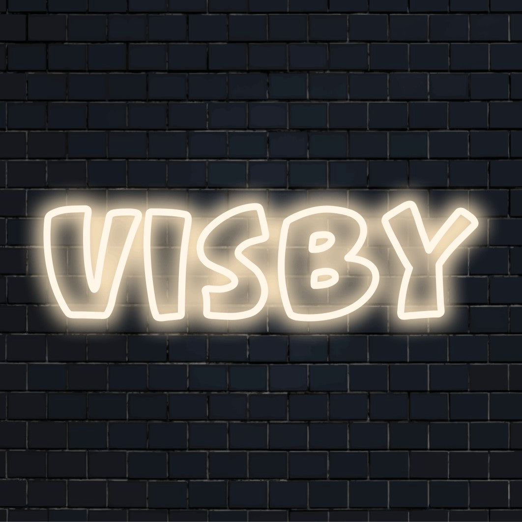 Visby Neon Light with glowing neon text against black brick wall