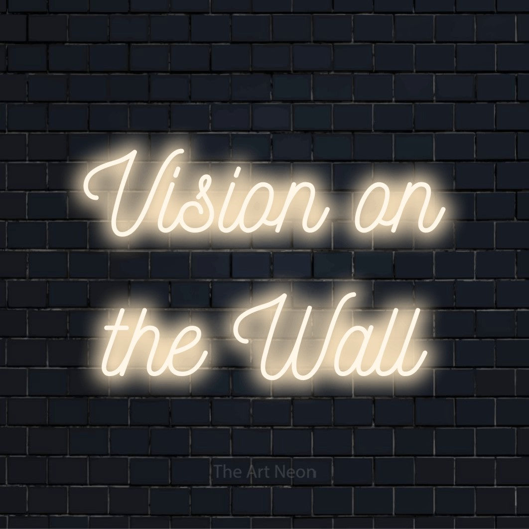 "Vision On The Wall" neon text design on a black brick wall