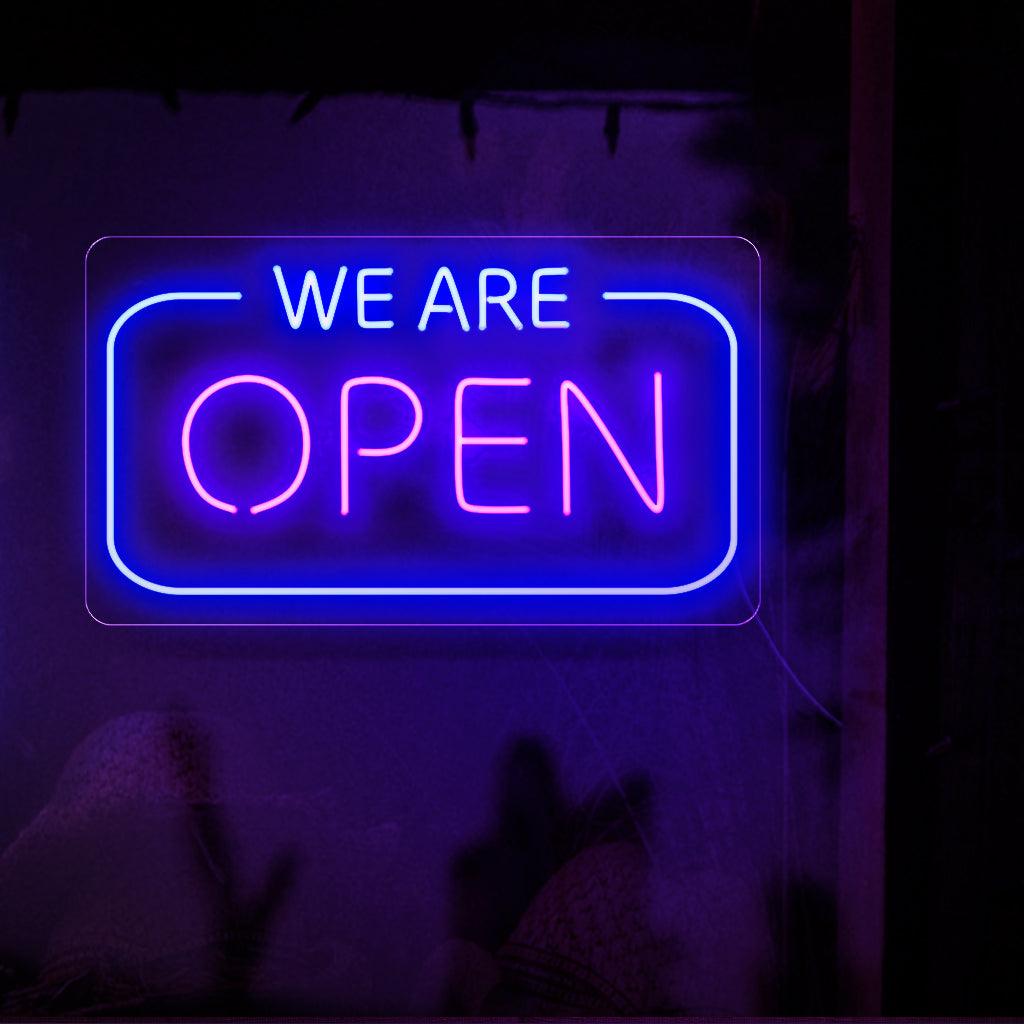 Um letreiro de neon cativante exibindo orgulhosamente as palavras "Estamos abertos" em letras grandes e brilhantes, sinalizando que uma empresa está pronta e disponível para atender seus clientes.