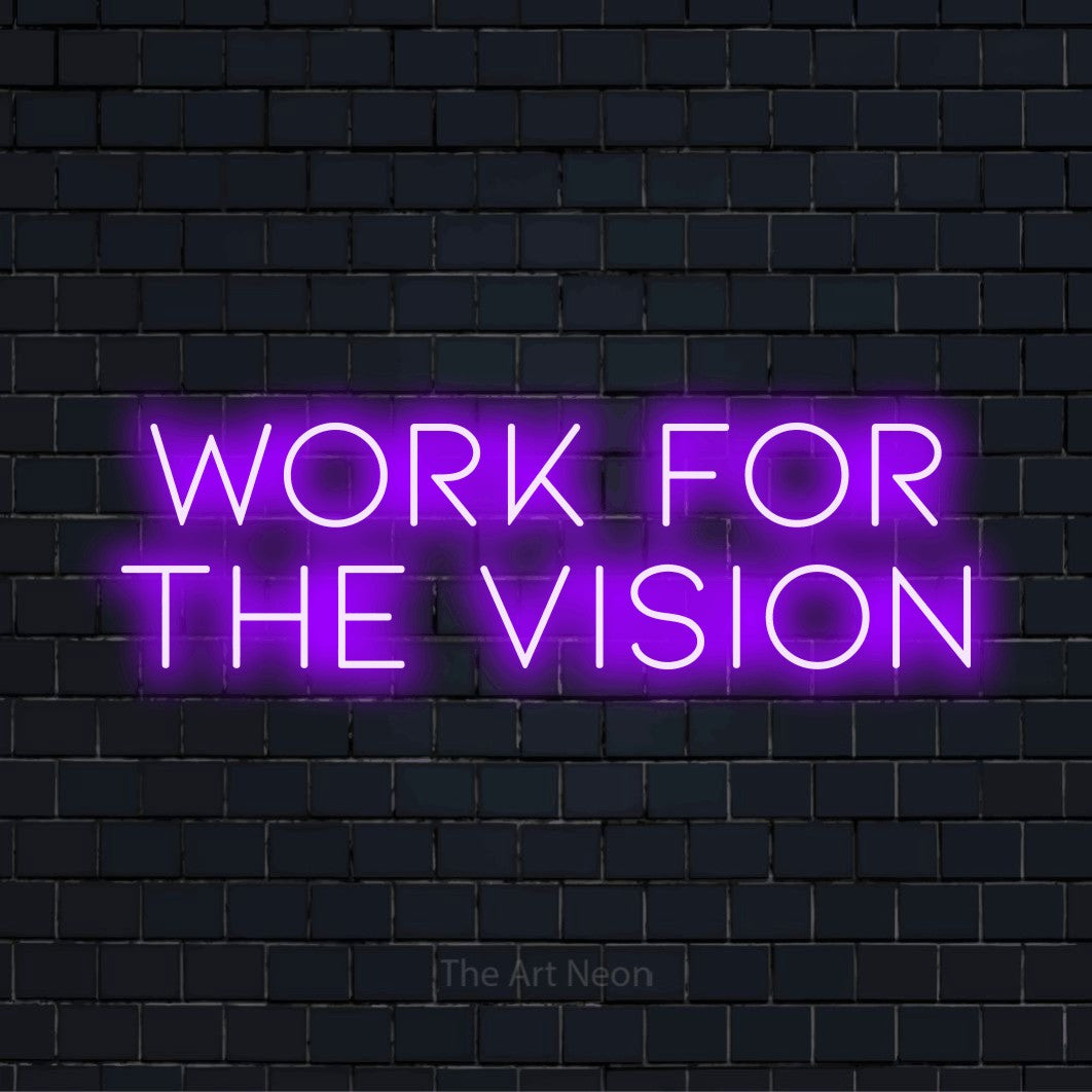"Work For The Vision" glowing LED neon sign on a black brick wall