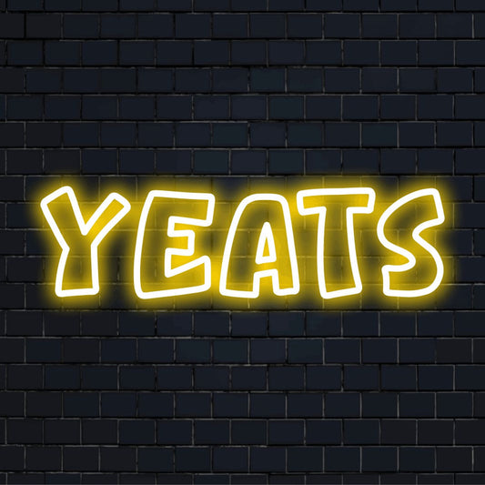 Yeats Neon Sign, glowing lettering on dark brick background
