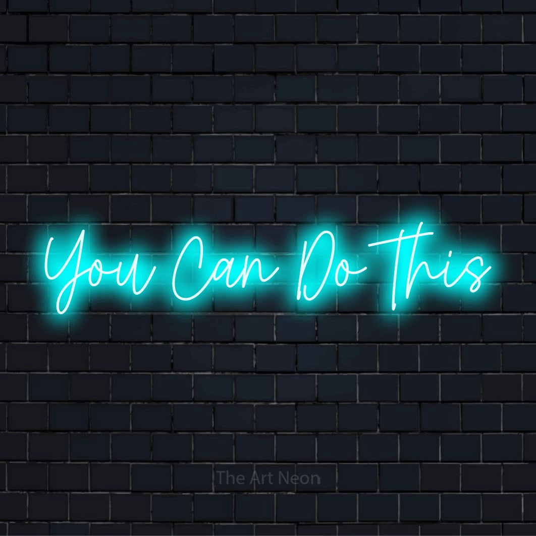 "You Can Do This" neon text design on a black brick wall