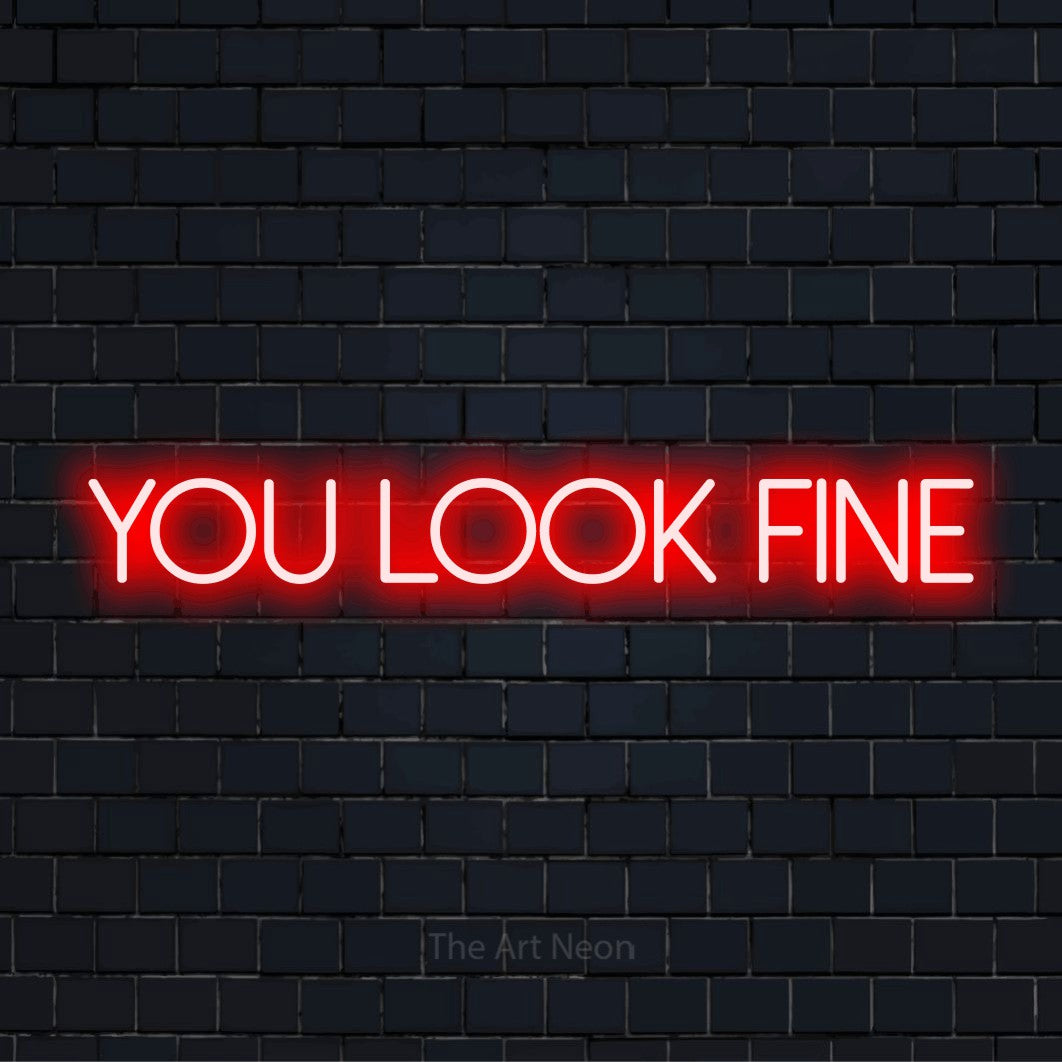 "You Look Fine" neon text design on a black brick wall