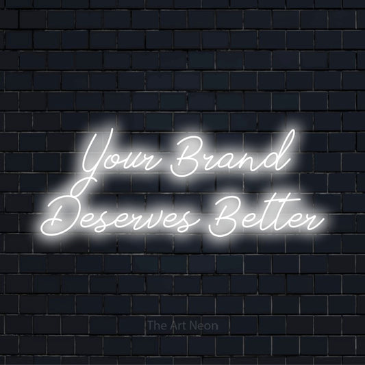 "Your Brand Deserves Better" text design with neon effect on a black brick wall